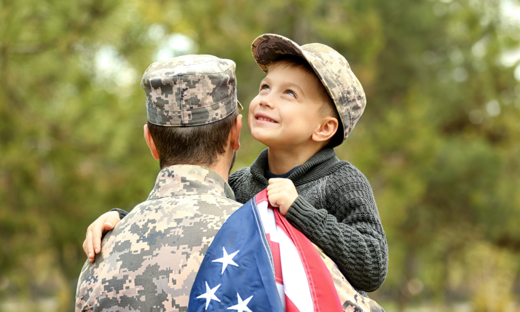 military dad and son with american flag